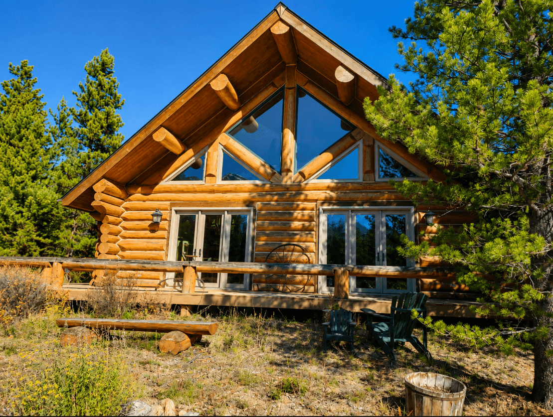 Log cabin exterior with large triangular gable picture windows and glass patio doors installed by American Remodeling