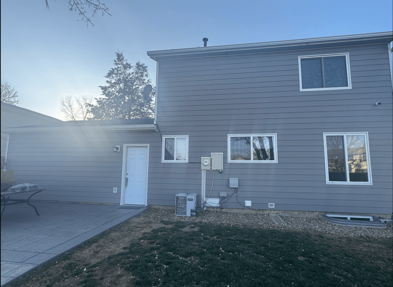 Gray Siding & White Windows — Siding project in South Dakota