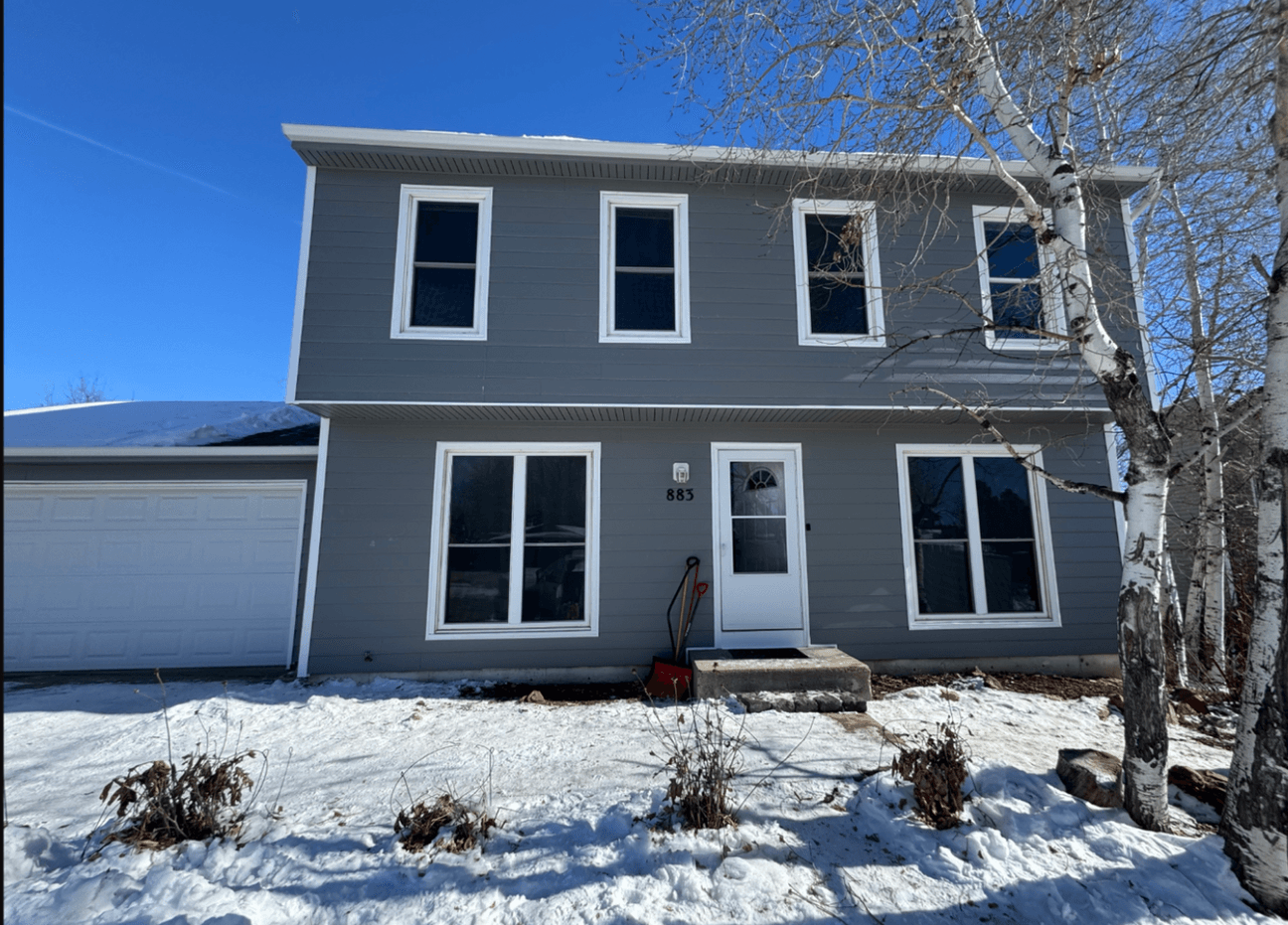 Two-Story Gray Siding & White Windows — siding project in Texas